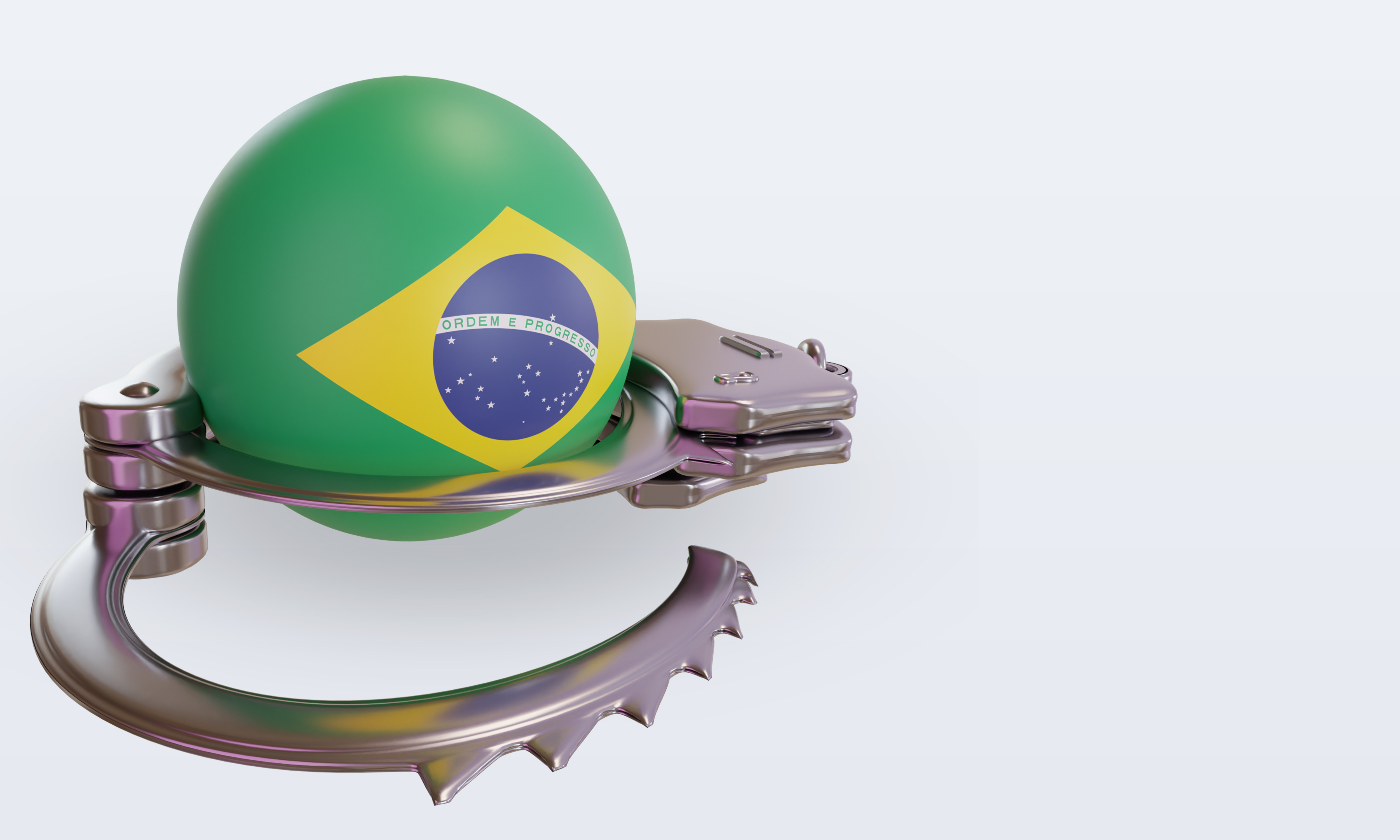 Un ballon décoré du drapeau du Brésil est entouré de menottes.